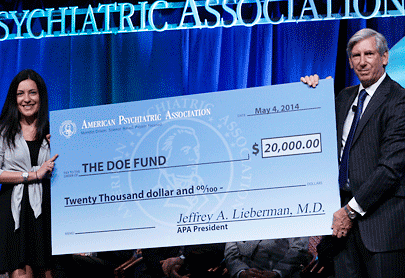 Jeffrey Lieberman, M.D., presented a check 