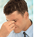 person holding forehead
